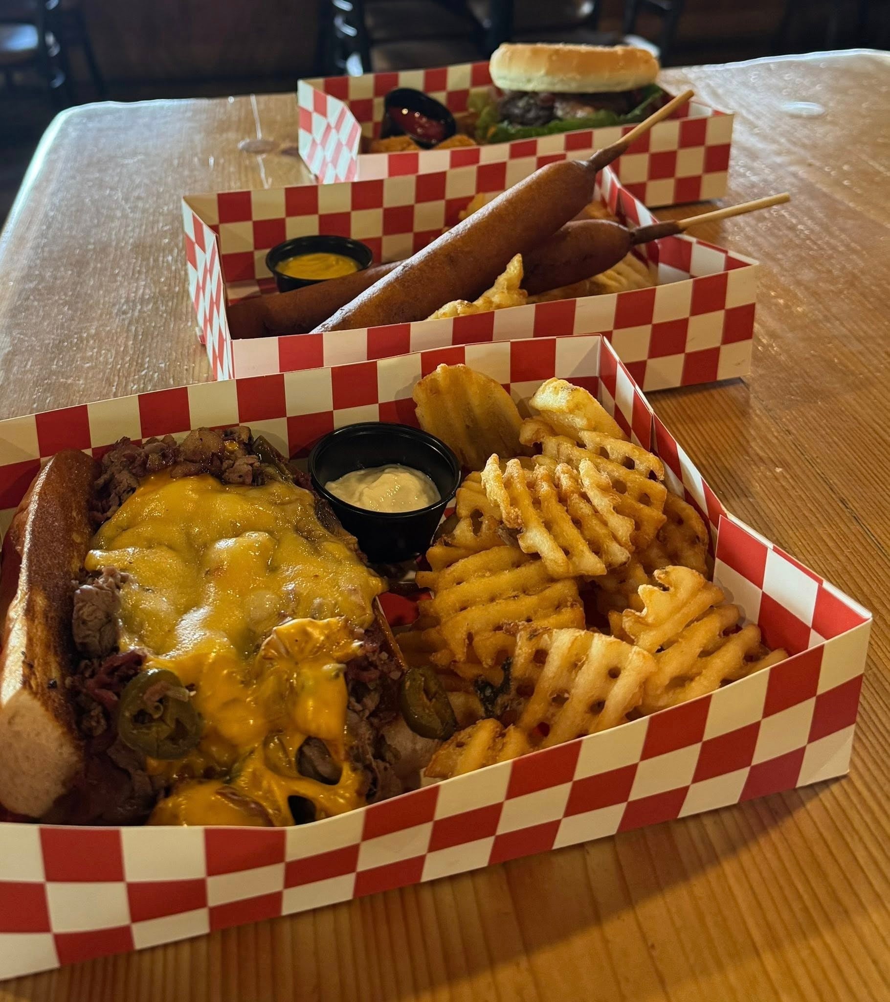 Prairie Tavern food truck baskets with corn dogs, fries, and sandwiches